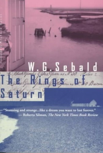 Cover of the New Directions paperback edition of The Rings of Saturn by W. G. Sebald, a two-tone photographic collage of a coastal path, weathered wooden posts, and handwritten marginal notes in faded pink and blue.